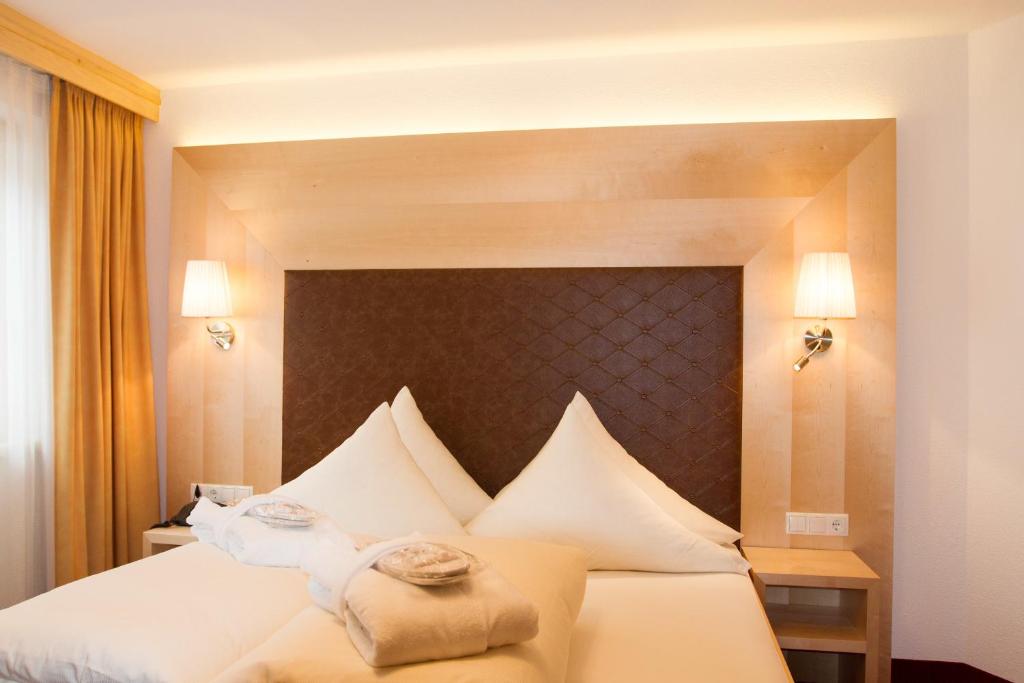 Postel nebo postele na pokoji v ubytování Hotel Albona