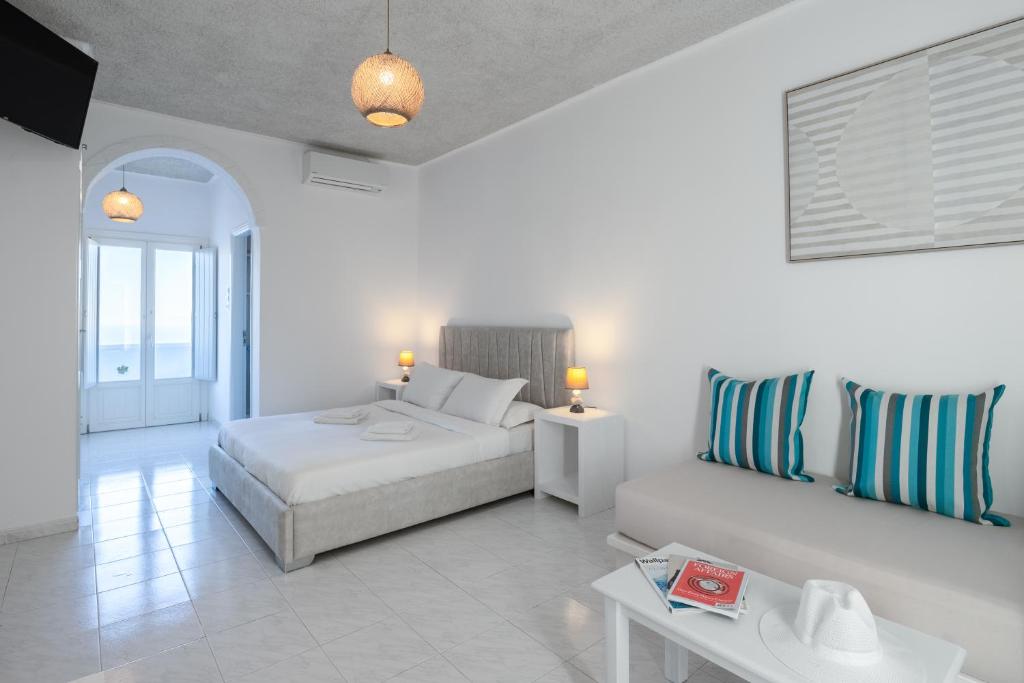 Ένα ή περισσότερα κρεβάτια σε δωμάτιο στο Nevma Suites