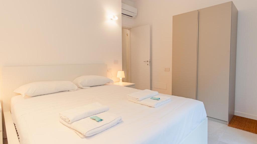 Ένα ή περισσότερα κρεβάτια σε δωμάτιο στο Da Silvana in Piazza Duomo - Italian Homing