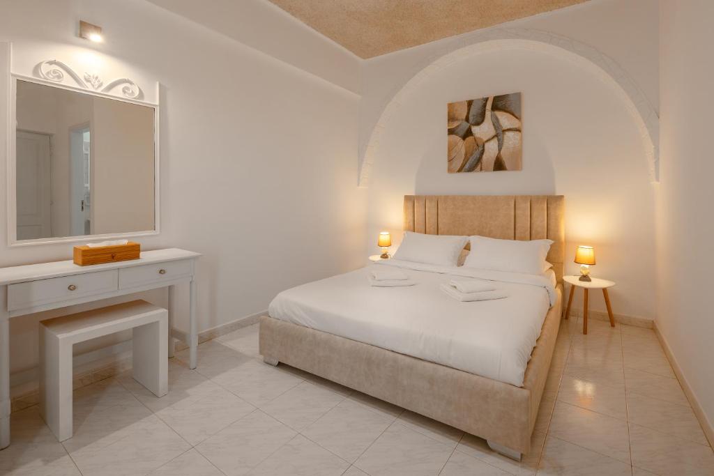 Ένα ή περισσότερα κρεβάτια σε δωμάτιο στο Nevma Suites