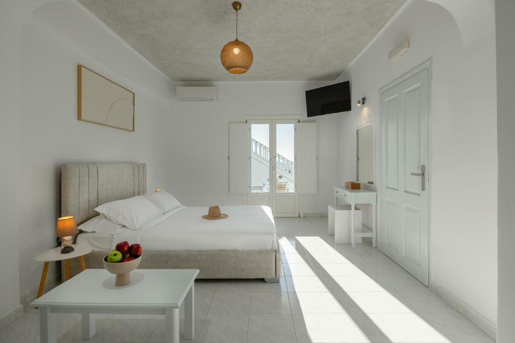 Ένα ή περισσότερα κρεβάτια σε δωμάτιο στο Nevma Suites