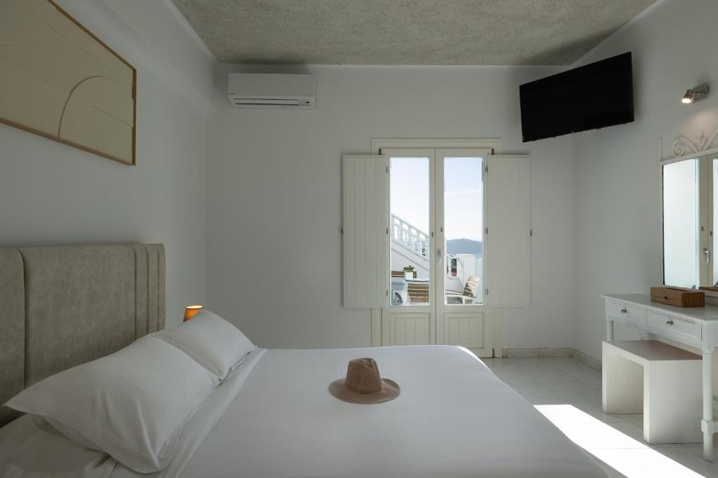 Ένα ή περισσότερα κρεβάτια σε δωμάτιο στο Nevma Suites