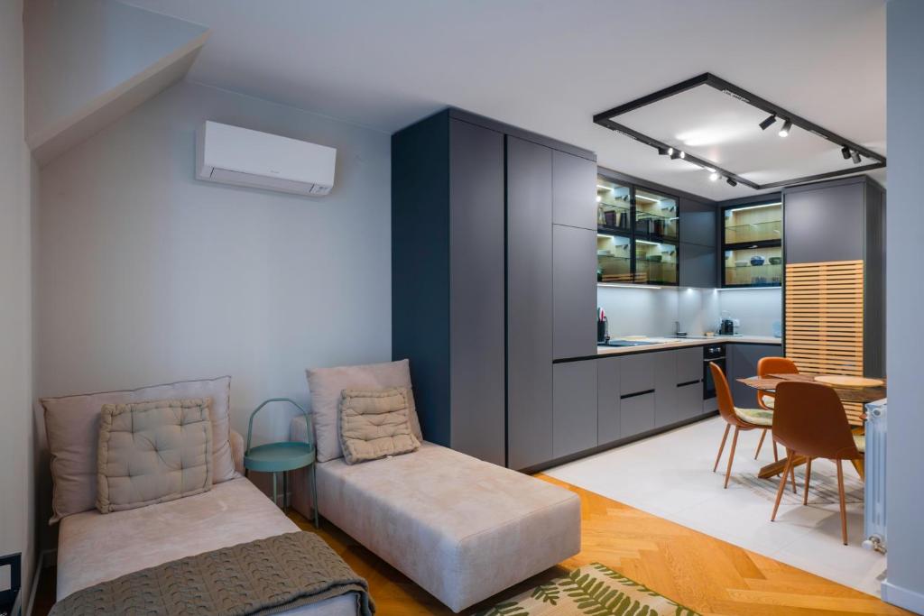 a bedroom with a bed and a dining room at Exclusive One-Bedroom Retreat in Sofia