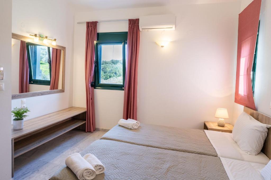 A bed or beds in a room at Elarchon Villa Private Pool