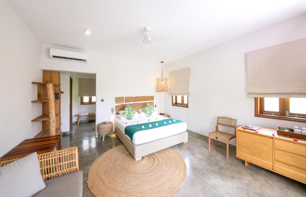 Postel nebo postele na pokoji v ubytování Les Lauriers Eco Hotel