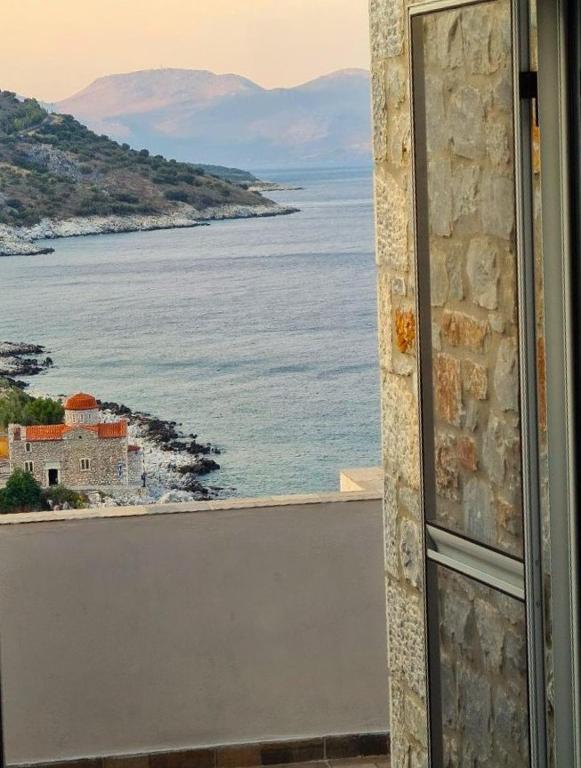 a view of the ocean from a window at Royal View in Mani in Kokkala