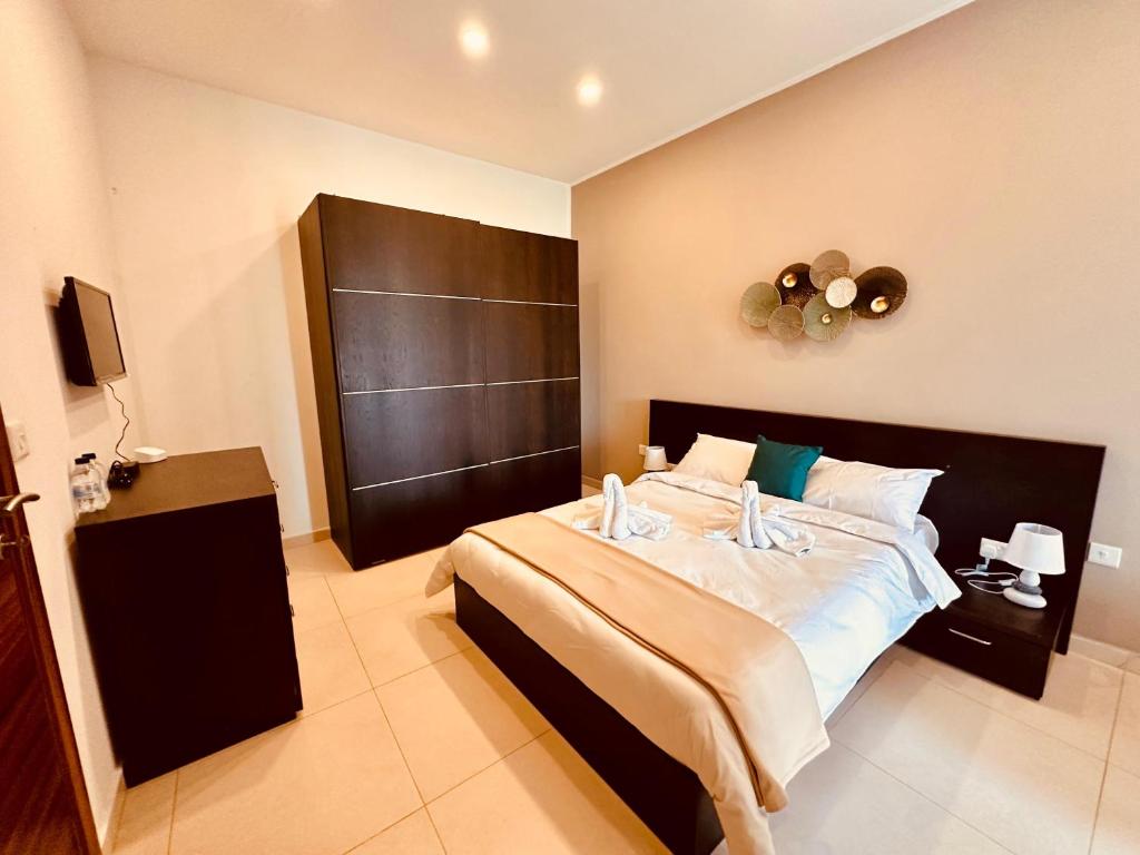 Cama ou camas em um quarto em Dome Luju