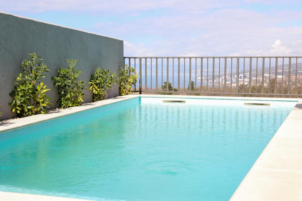 a swimming pool on the roof of a building at VILLA MARIS SMRIKA -heated pool in Šmrika