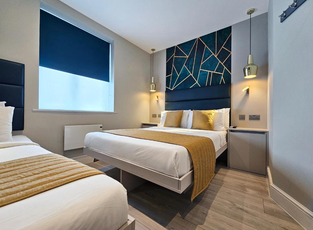 Cama ou camas em um quarto em NOX Hyde Park