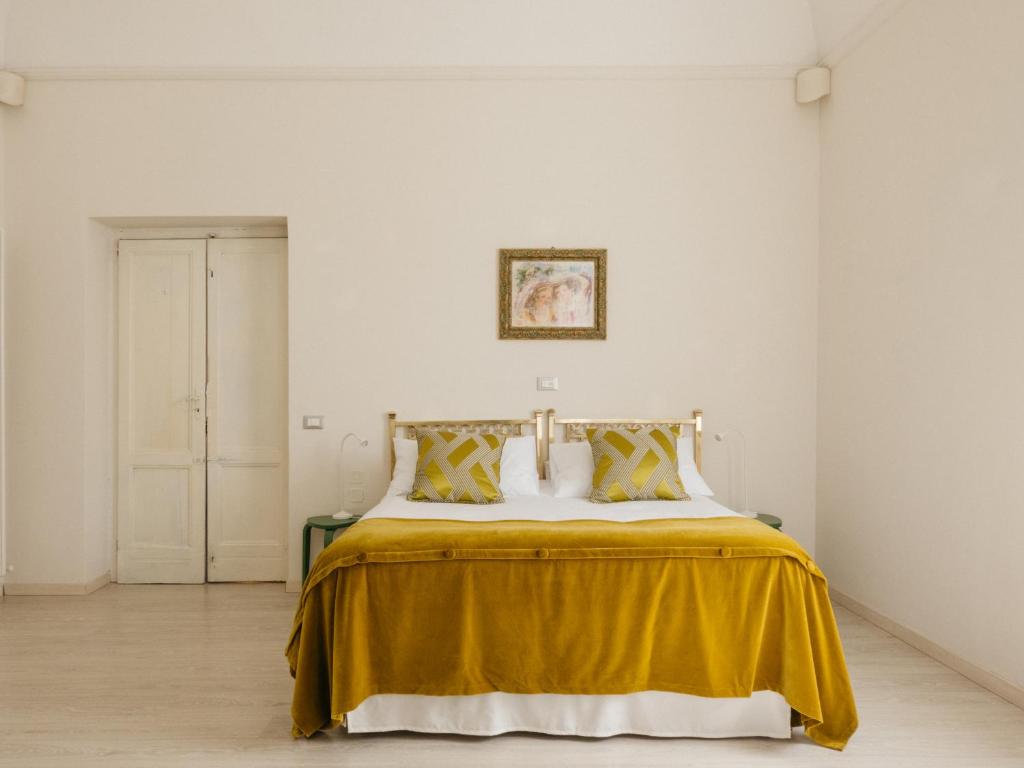 Un pat sau paturi într-o cameră la Casa Tamo