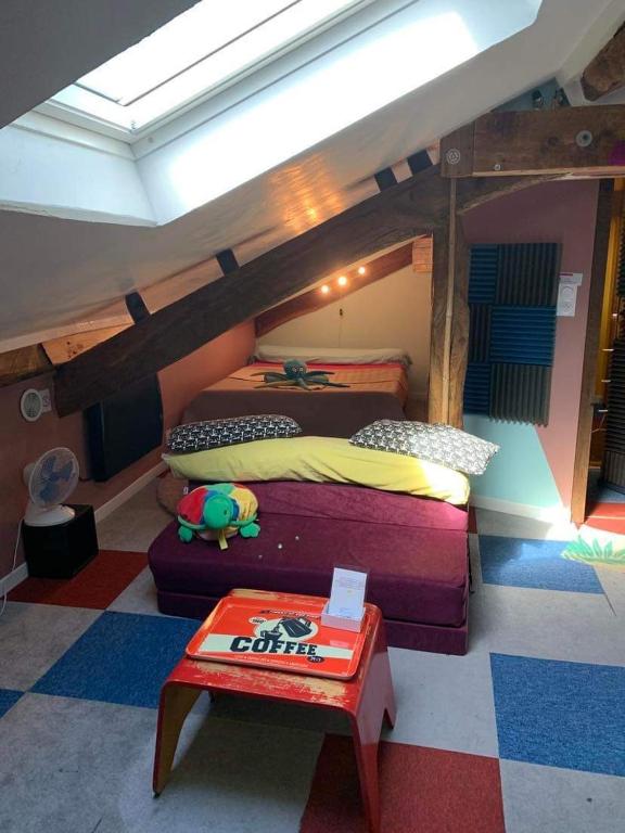 Chambres chez l&#39;habitant Bambou et Musique cuisine et sdb partag&eacute;es tesisinde bir odada yatak veya yataklar