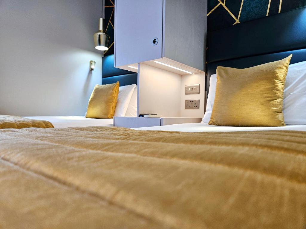 Cama ou camas em um quarto em NOX Hyde Park