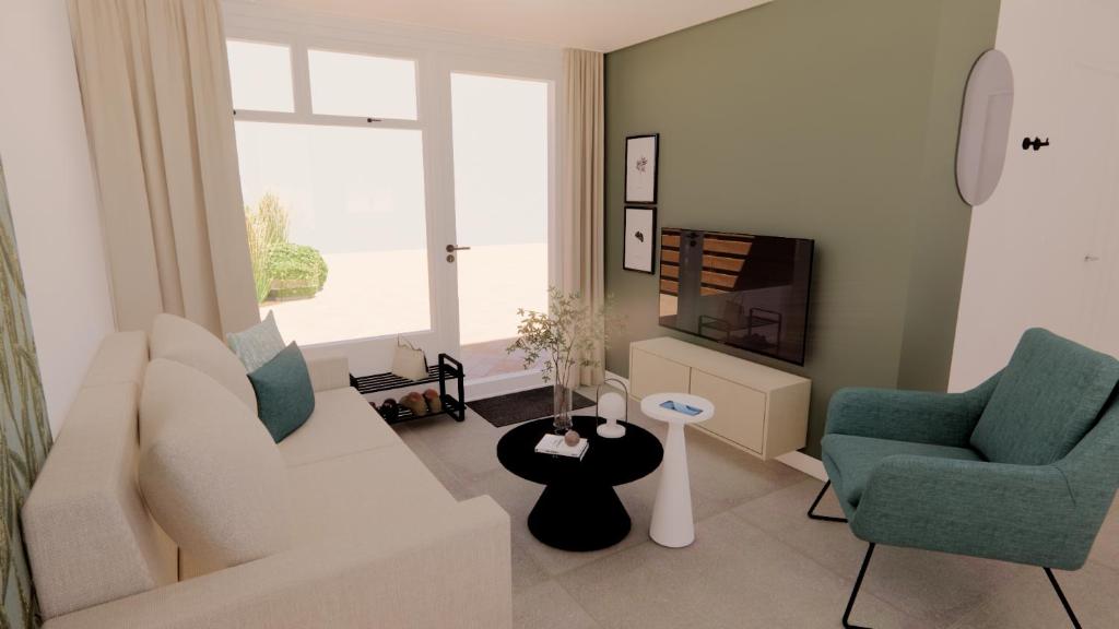ein Wohnzimmer mit einem Sofa, 2 Stühlen und einem TV in der Unterkunft Vakantiewoning Westkapelle Piet Mondriaanpad 1 in Westkapelle