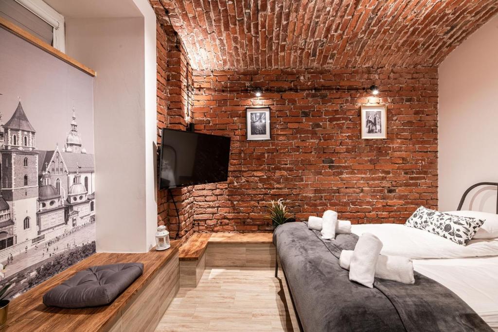 Voodi või voodid majutusasutuse DIETLA 99 APARTMENTS - IDEAL LOCATION - in the heart of Krakow toas