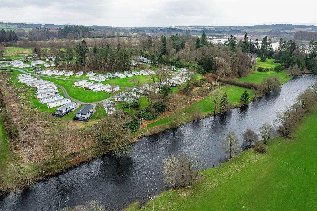 an aerial view of a campground next to a river at Callander Woods Holiday Park in Callander