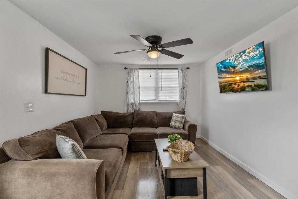 a living room with a couch and a ceiling fan at 217 E Hildreth Ave, Unit 4 in Wildwood