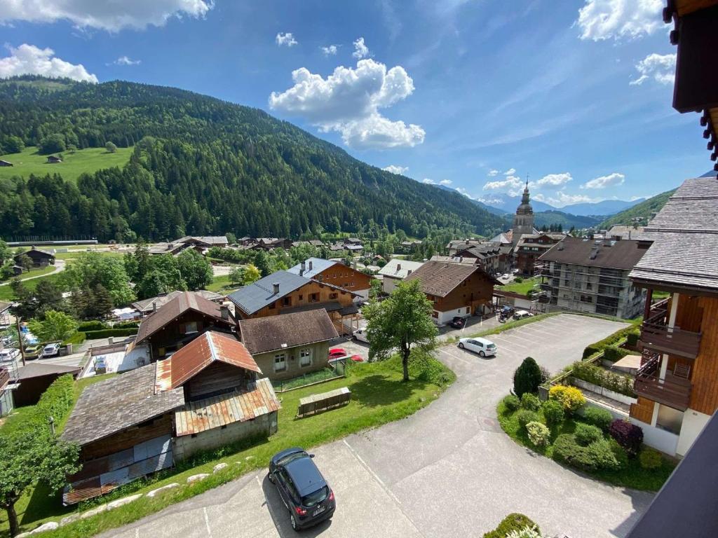 a small town with a mountain in the background at Appartement Le Grand-Bornand, 3 pièces, 6 personnes - FR-1-241-61 in Le Grand-Bornand