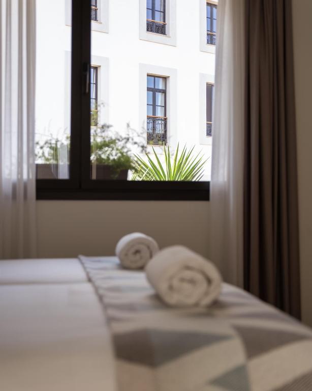 Postel nebo postele na pokoji v ubytování Apartamentos Las Indianas