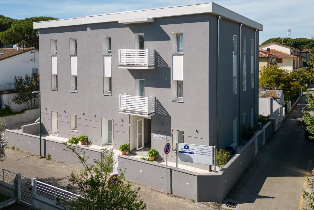 a building with two balconies on the side of it at Residence Cervia in Cervia