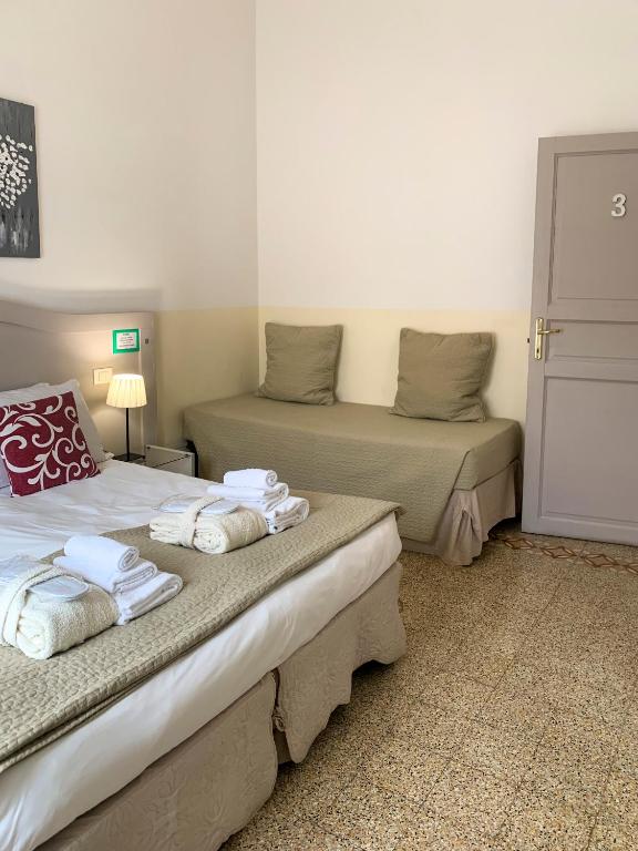 Postel nebo postele na pokoji v ubytování Biancorèroma B&B