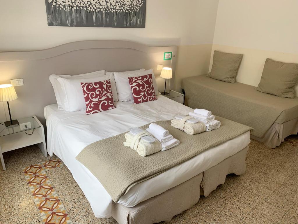 Postel nebo postele na pokoji v ubytování Biancorèroma B&B