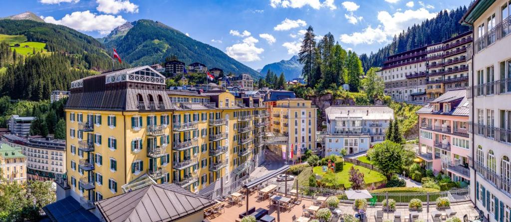 an aerial view of a city with buildings and mountains at MONDI Hotel Bellevue Gastein in Bad Gastein