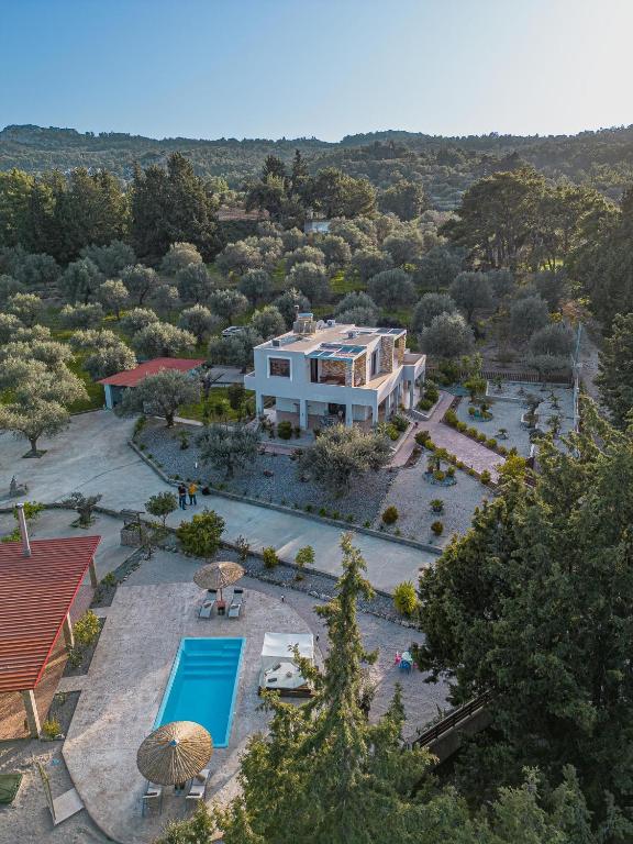 an aerial view of a house with a swimming pool at Physis Luxury Villa in Archangelos