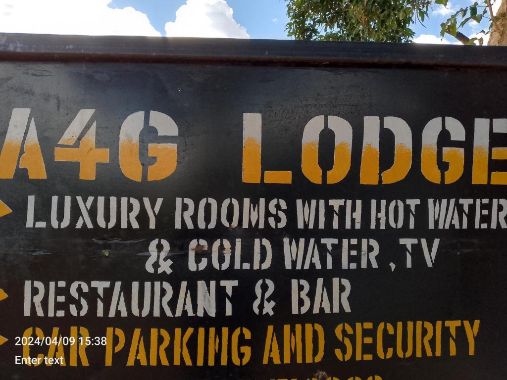 a sign that says london luxury rooms with hot water and cold water istg at A 4G LODGE in Mugumu