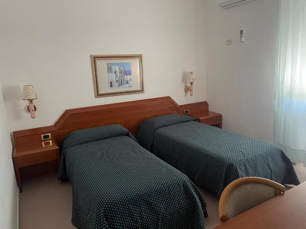 Postel nebo postele na pokoji v ubytování HOTEL SOLE