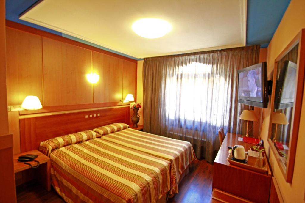 Postel nebo postele na pokoji v ubytování Hotel Paris Centro