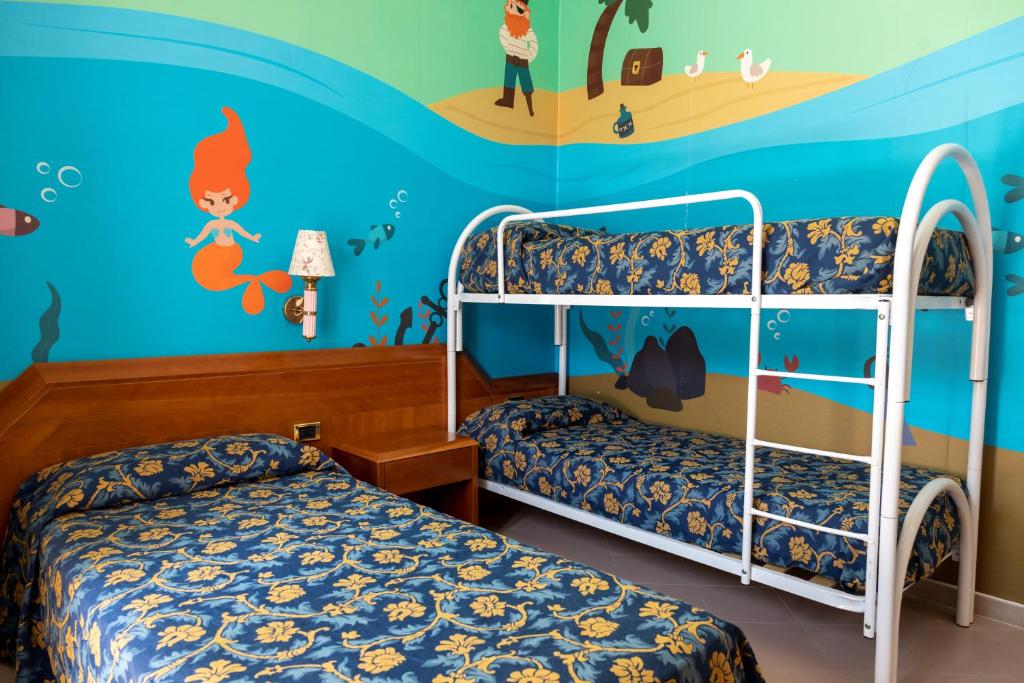 Postel nebo postele na pokoji v ubytování HOTEL SOLE