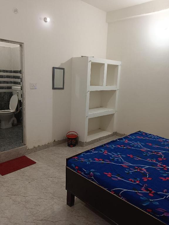 Postel nebo postele na pokoji v ubytování Ramrameti Homestay
