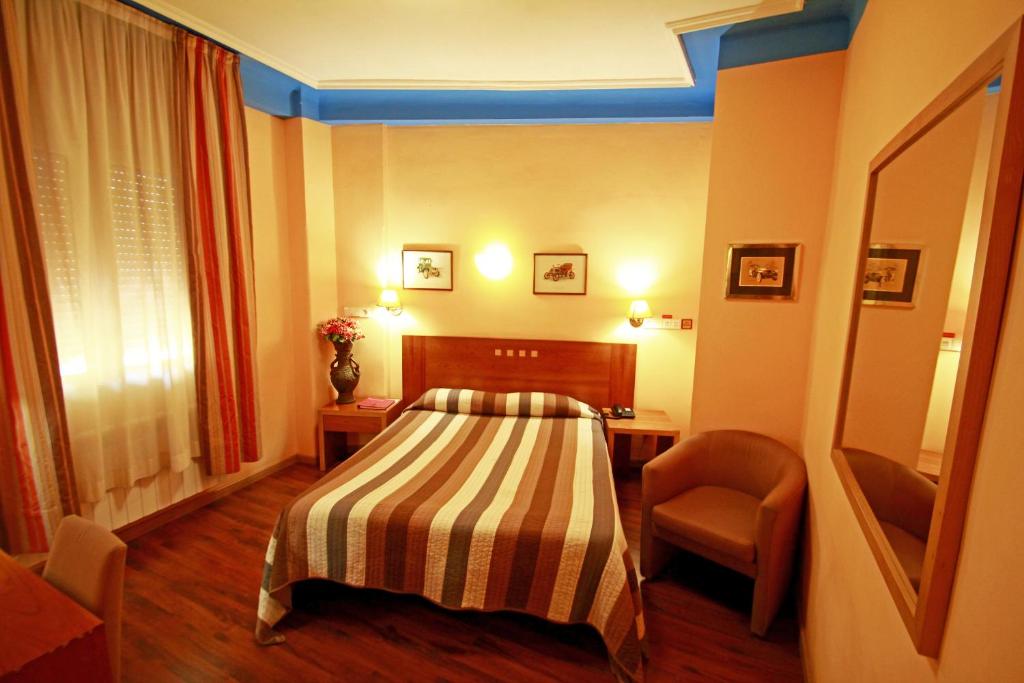 Postel nebo postele na pokoji v ubytování Hotel Paris Centro