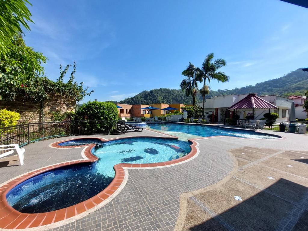 a swimming pool with a design in the middle at Hotel Campestre la Vega Inn in La Vega
