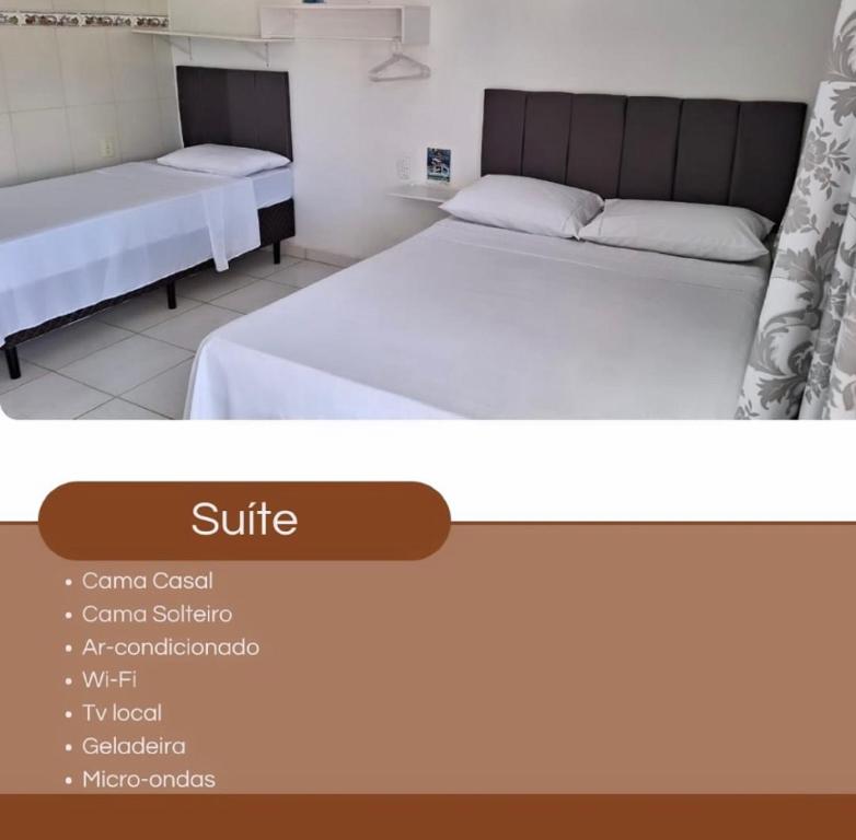 duas camas num quarto com duas camas sidx sidx em Suítes na Barra da Lagoa em Florianópolis