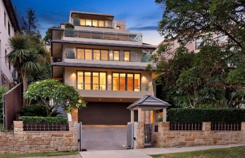 a large house with a lot of windows at Manly Harbourside Villa in Sydney