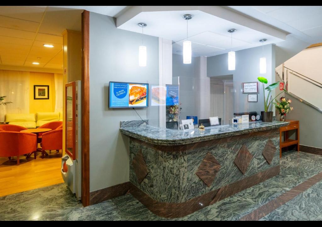 TV a/nebo společenská místnost v ubytování Hotel Mozárbez Salamanca