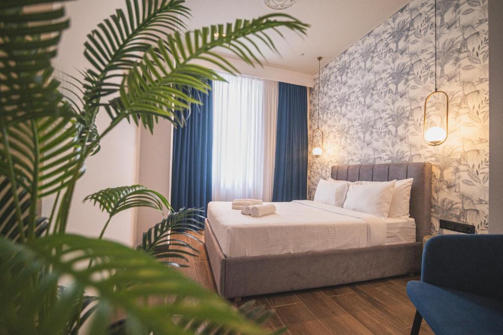 Postel nebo postele na pokoji v ubytování Downtown Suites by Athens Tower