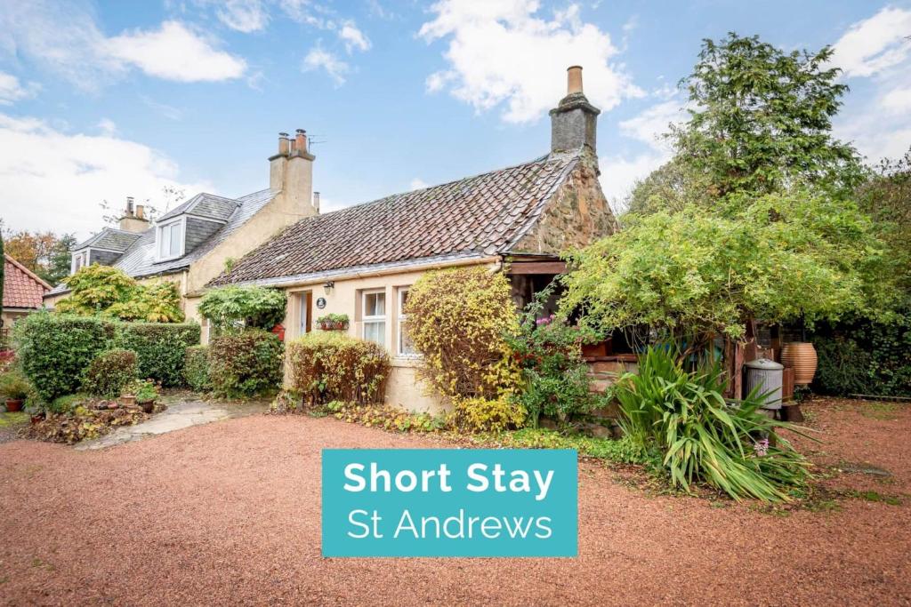 an image of a house with the words short stay st amances at Mill Cottage - Cosy & Quaint Cottage - 10 mins from St Andrews in Boarhills