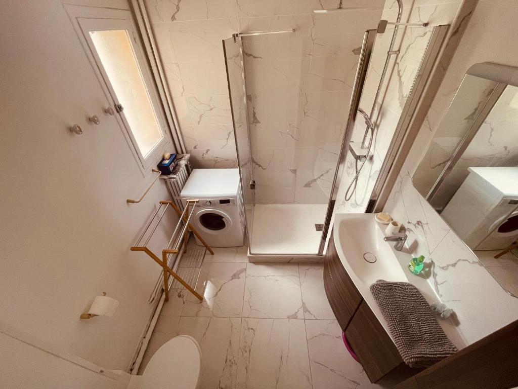 a bathroom with a shower and a sink and a toilet at La brocante sur la seine -309 in Rouen