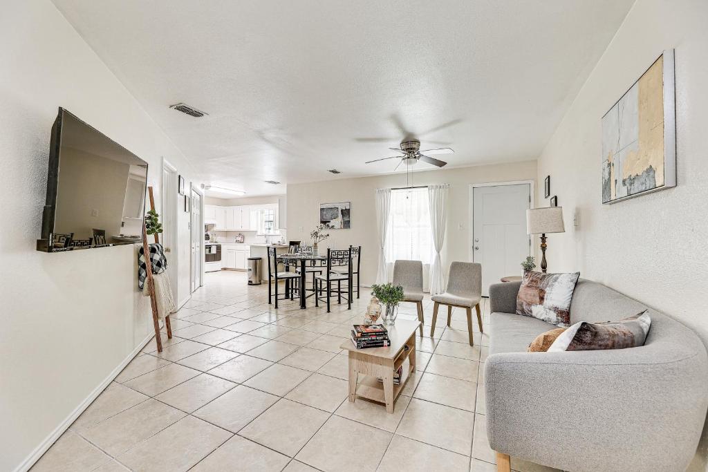 a living room with a couch and a table at Pet-Friendly Edinburg Townhome - Near Stadiums! in Edinburg