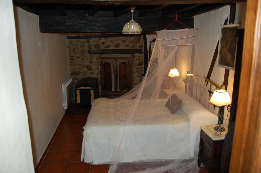 Cama o camas de una habitación en Apartamentos Rurales Tía Josefa
