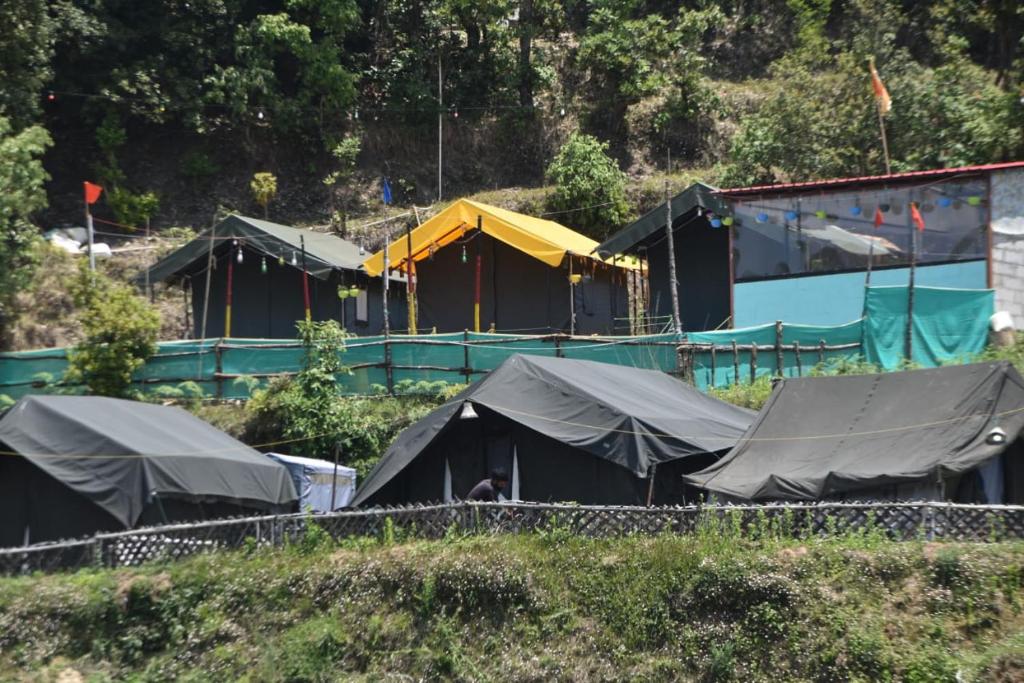 a group of tents on the side of a hill at Camp Moonlight beauty in Nainital