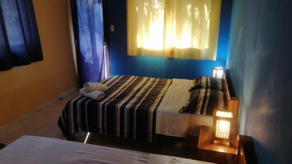 Postel nebo postele na pokoji v ubytování Punta Pacífico Bungalows Máncora