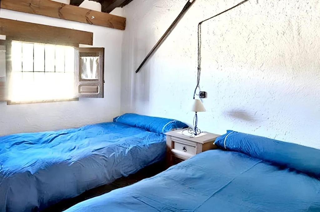 Posteľ alebo postele v izbe v ubytovaní Elegant Villa in Granada with Pool and Garden