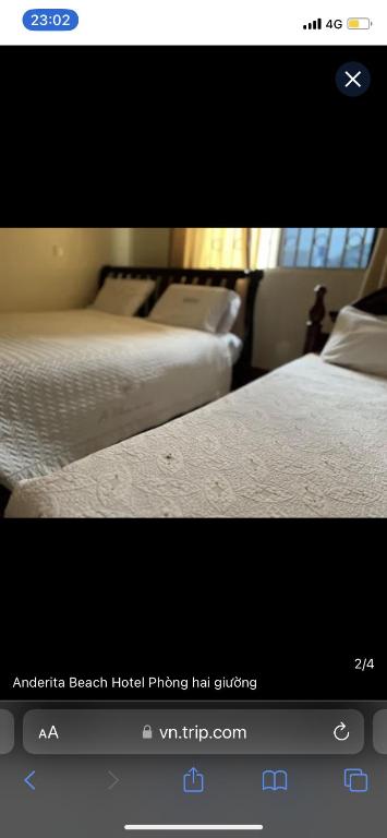 a picture of two beds in a bedroom at Global Connect Prop in Entebbe