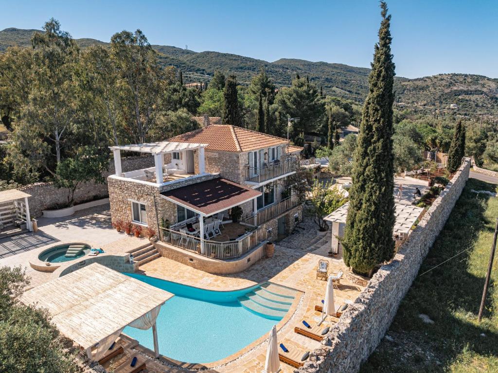 an aerial view of a house with a swimming pool at Louiza - Luxury Stone Villa in Volímai