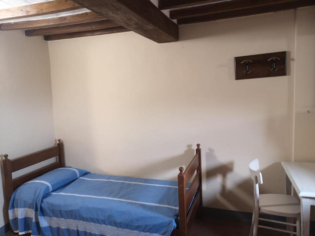 Postel nebo postele na pokoji v ubytování Ostello San Marco Cortona