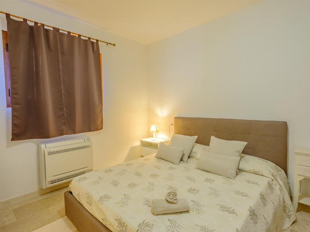 Posteľ alebo postele v izbe v ubytovaní Sardinia Family Villas - Villa Brunilde with private pool