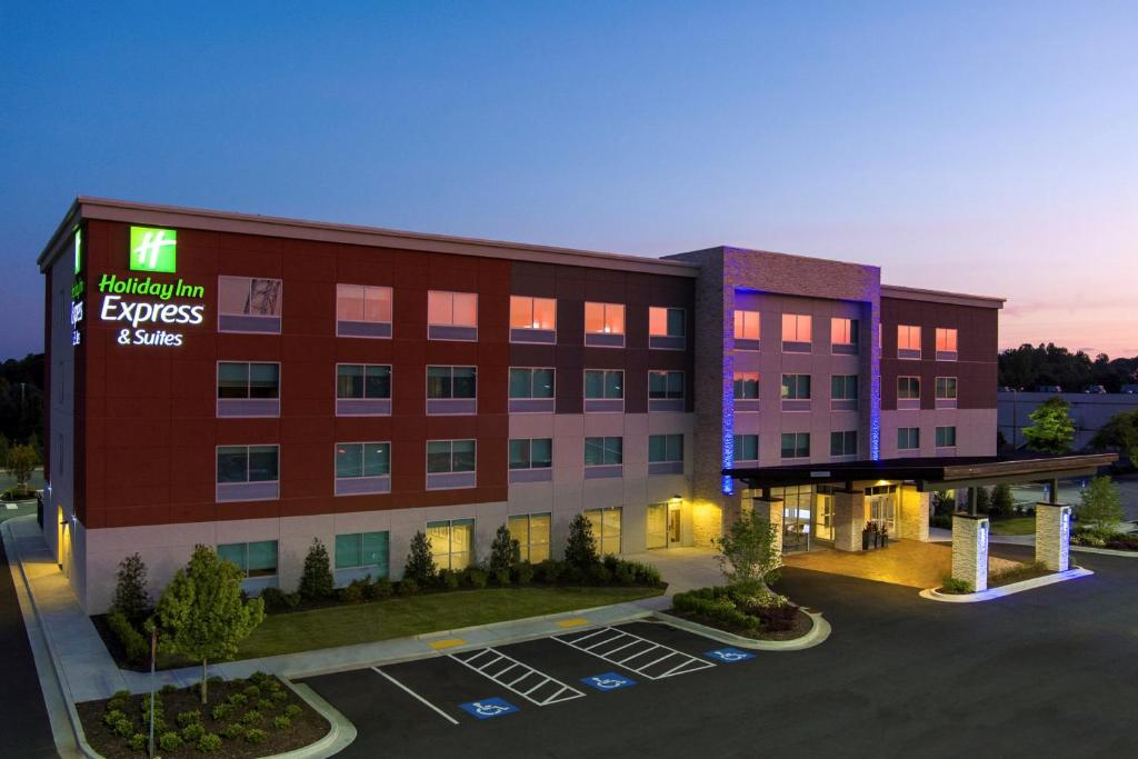 a rendering of a hotel building with a parking lot at Holiday Inn Express & Suites Griffin in Griffin